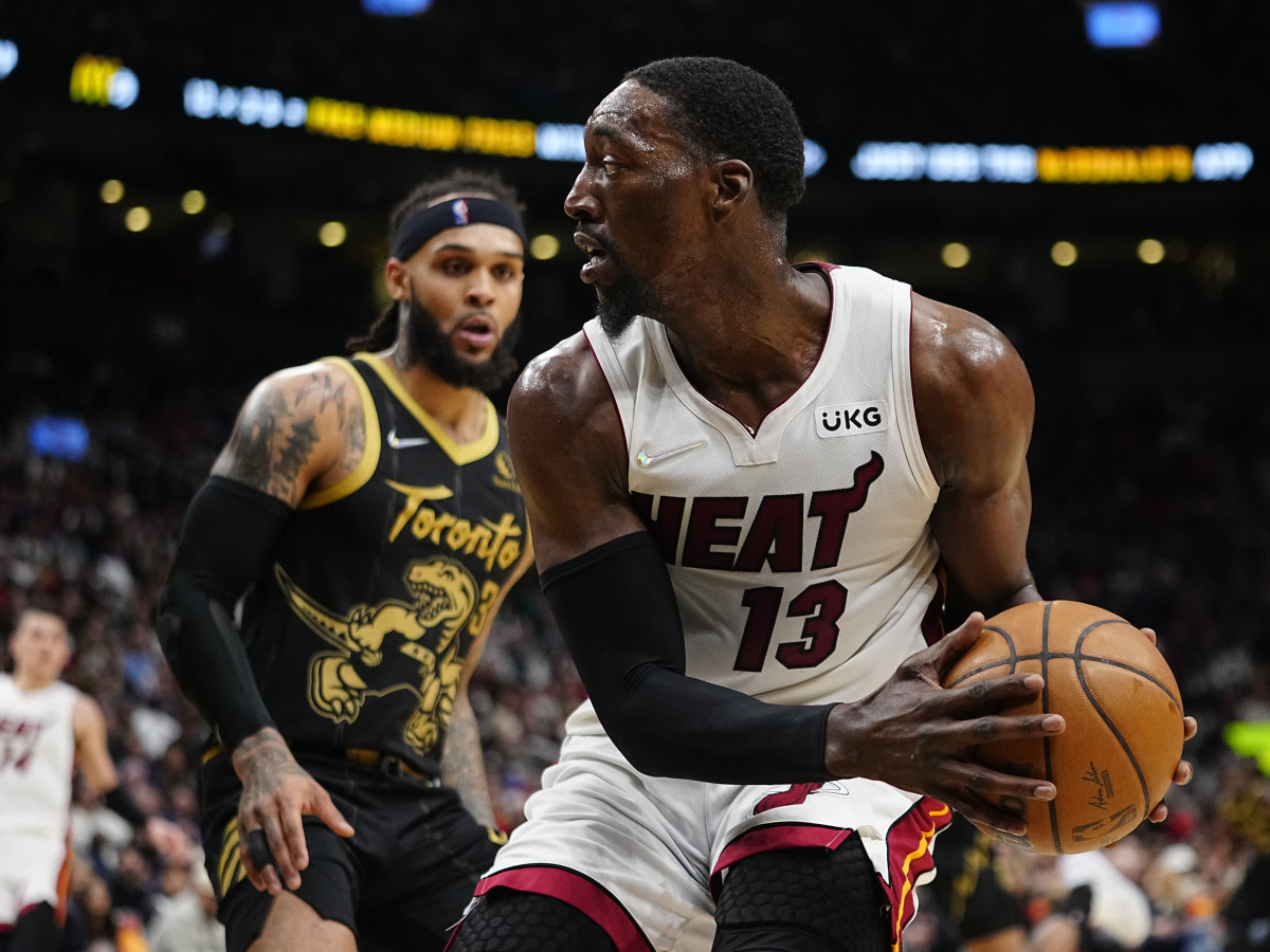 Apr 3, 2022; Toronto, Ontario, CAN; Miami Heat center Bam Adebayo (13) looks to pass the ball as Toronto Raptors guard Gary Trent Jr. (33) defends during the first half at Scotiabank Arena. Mandatory Credit: John E. Sokolowski-USA TODAY Sports